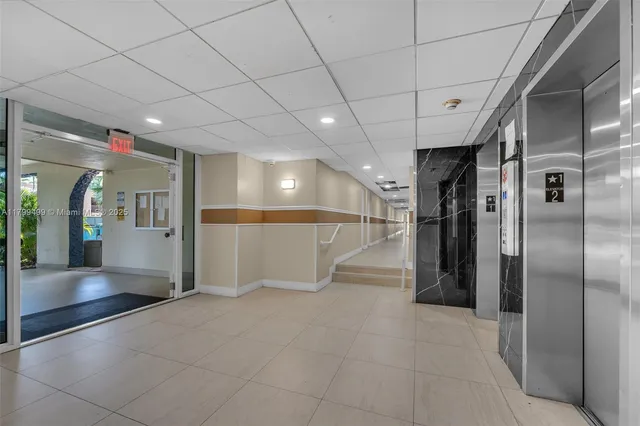 a view of a hallway with wooden shelves