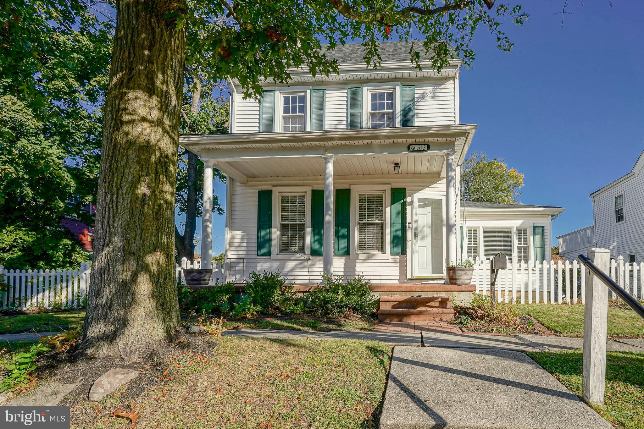 front view of a house with a small yard