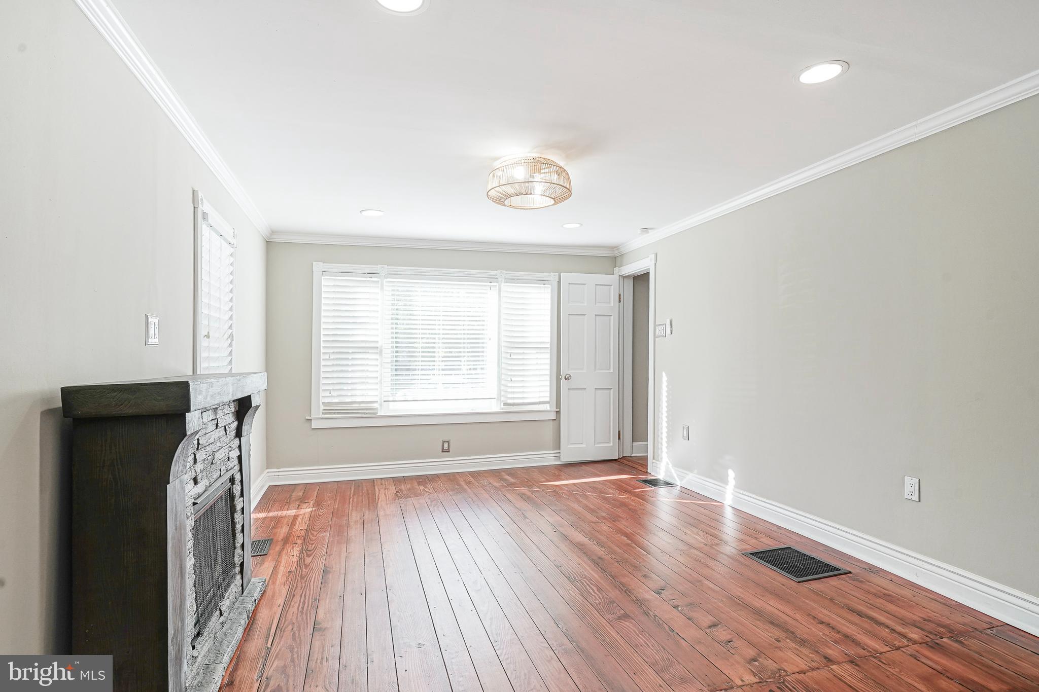 53 Branch Street Medford, NJ 08055 - Photo 14 of 41 a view of an empty room with wooden floor and a window