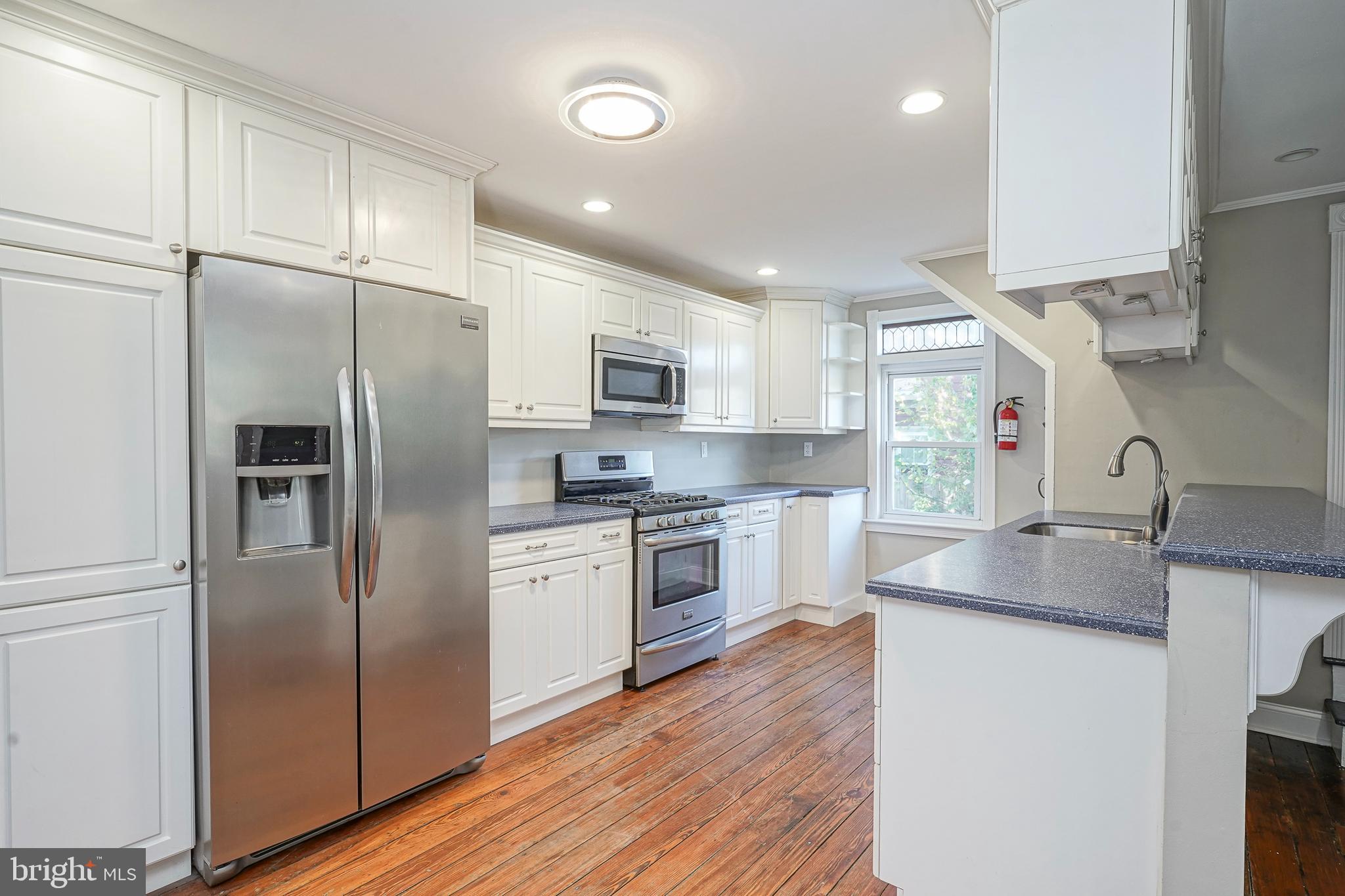 53 Branch Street Medford, NJ 08055 - Photo 18 of 41 a kitchen with stainless steel appliances granite countertop a refrigerator a sink and a stove