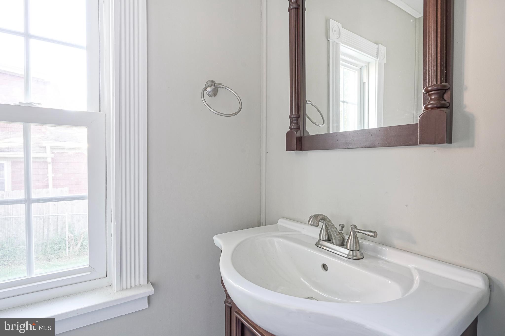 53 Branch Street Medford, NJ 08055 - Photo 25 of 41 a bathroom with a sink and a mirror