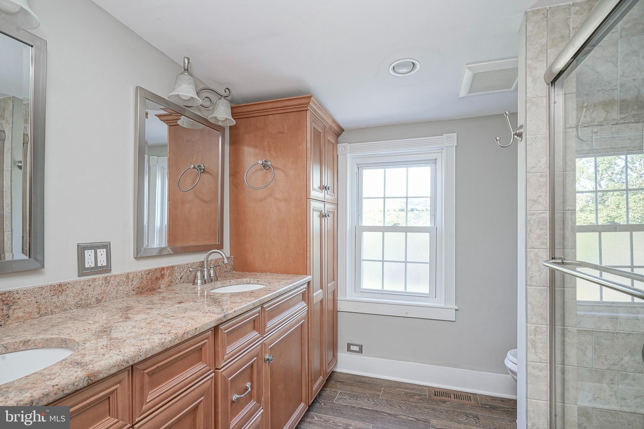 53 Branch Street Medford, NJ 08055 - Photo 26 of 41 a bathroom with a granite countertop sink and a mirror