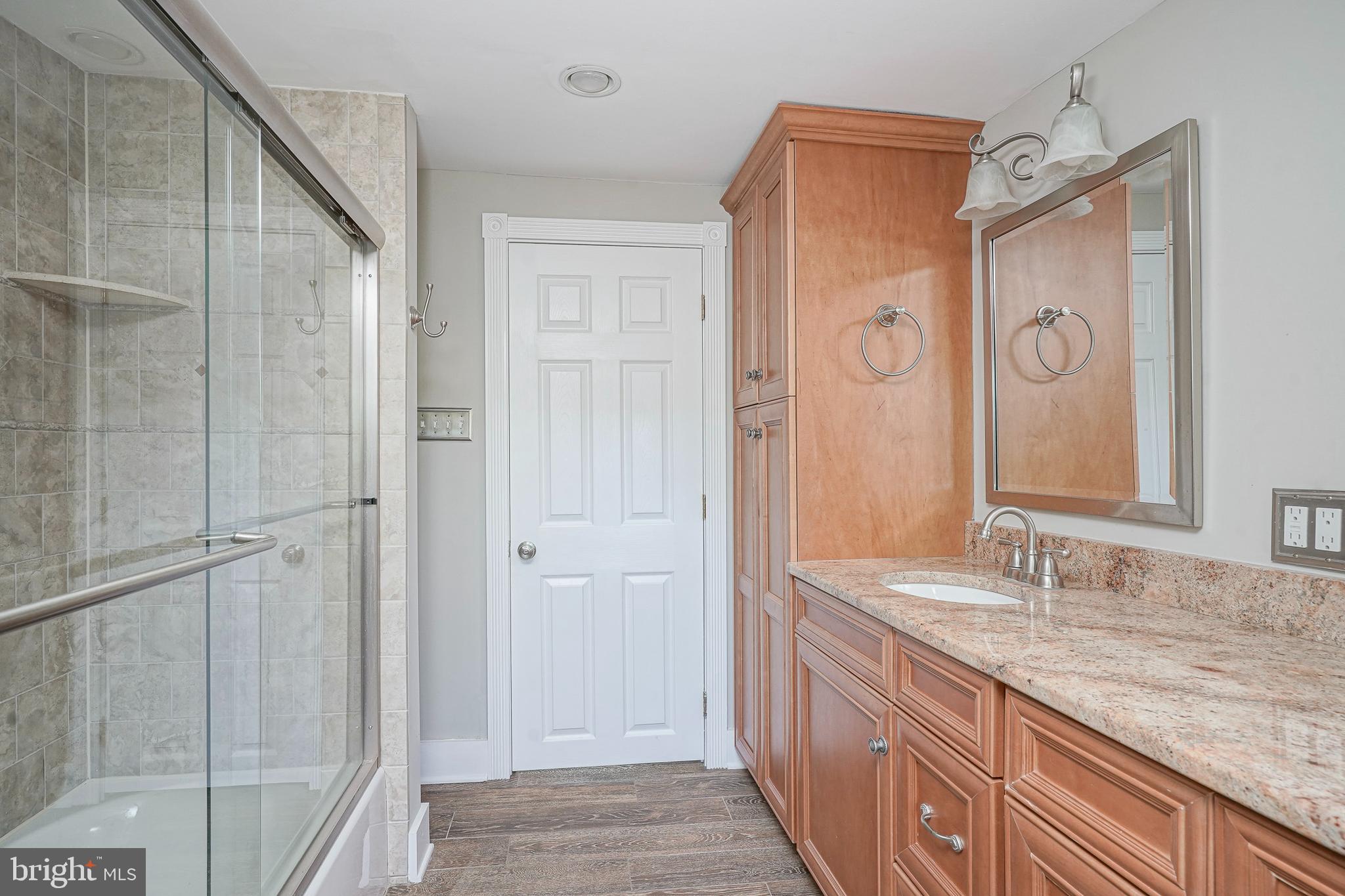 53 Branch Street Medford, NJ 08055 - Photo 27 of 41 a bathroom with a granite countertop sink mirror and double
