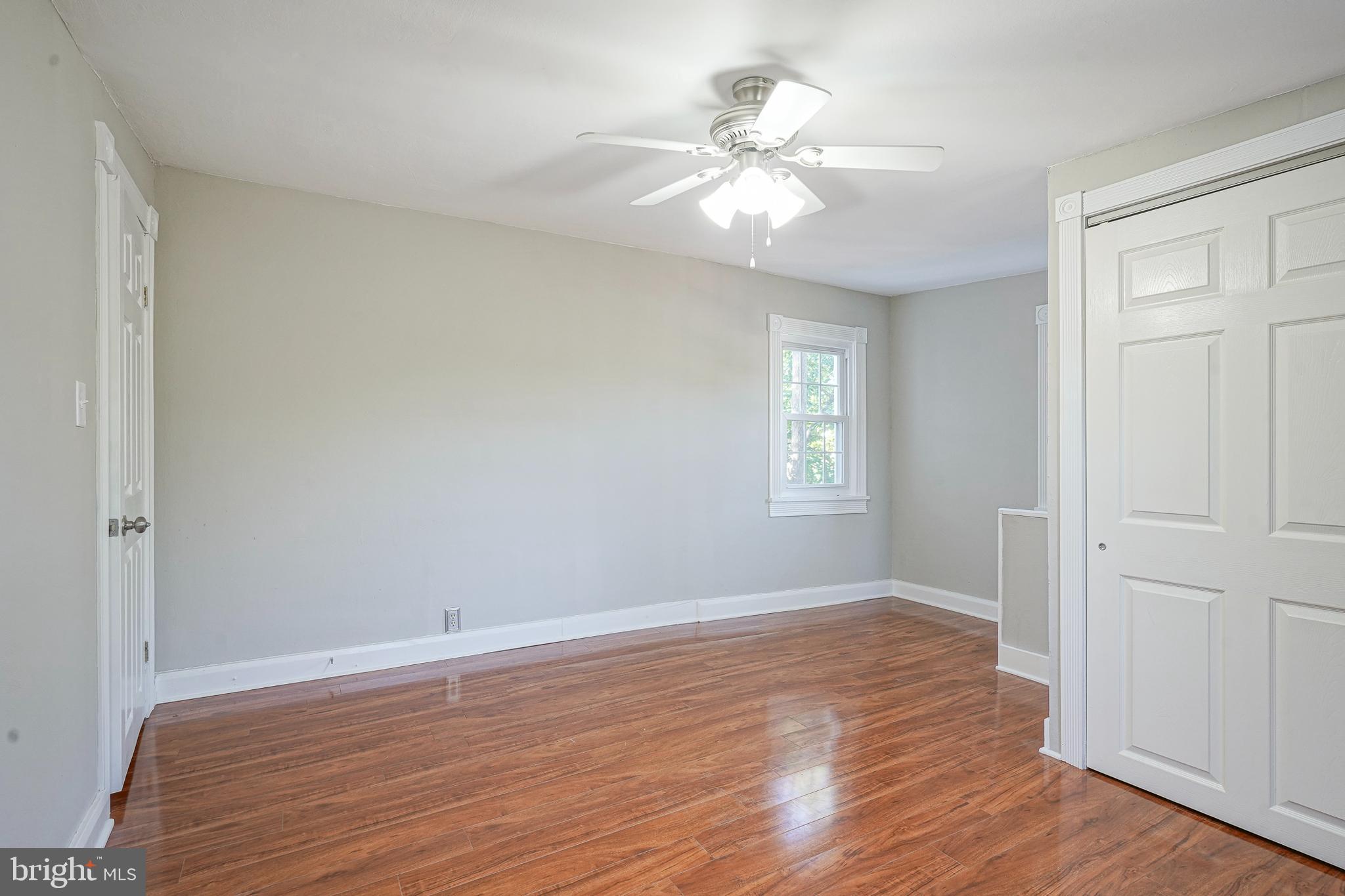 53 Branch Street Medford, NJ 08055 - Photo 31 of 41 a view of an empty room with wooden floor and a window