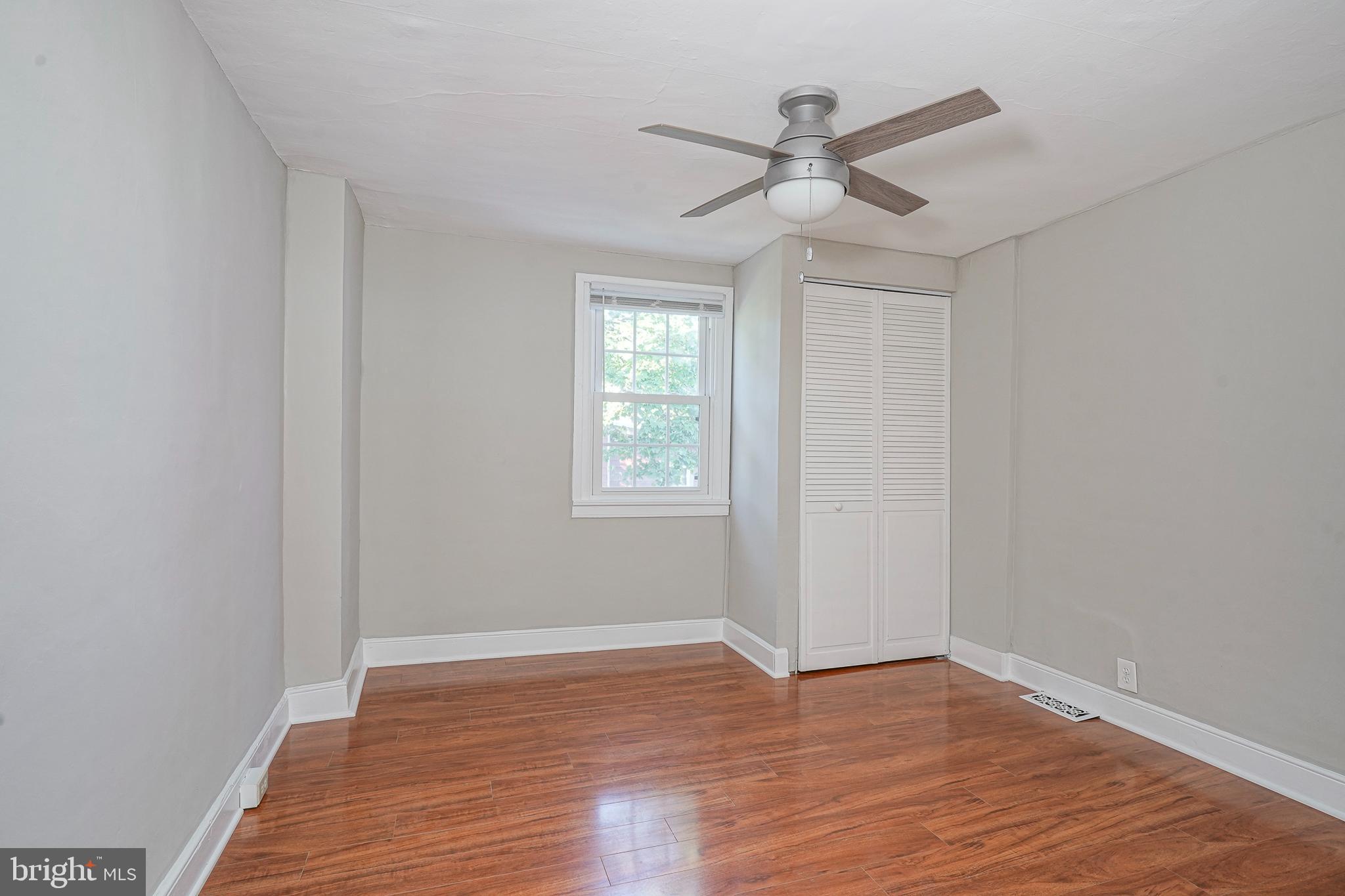 53 Branch Street Medford, NJ 08055 - Photo 32 of 41 an empty room with wooden floor ceiling fan and window