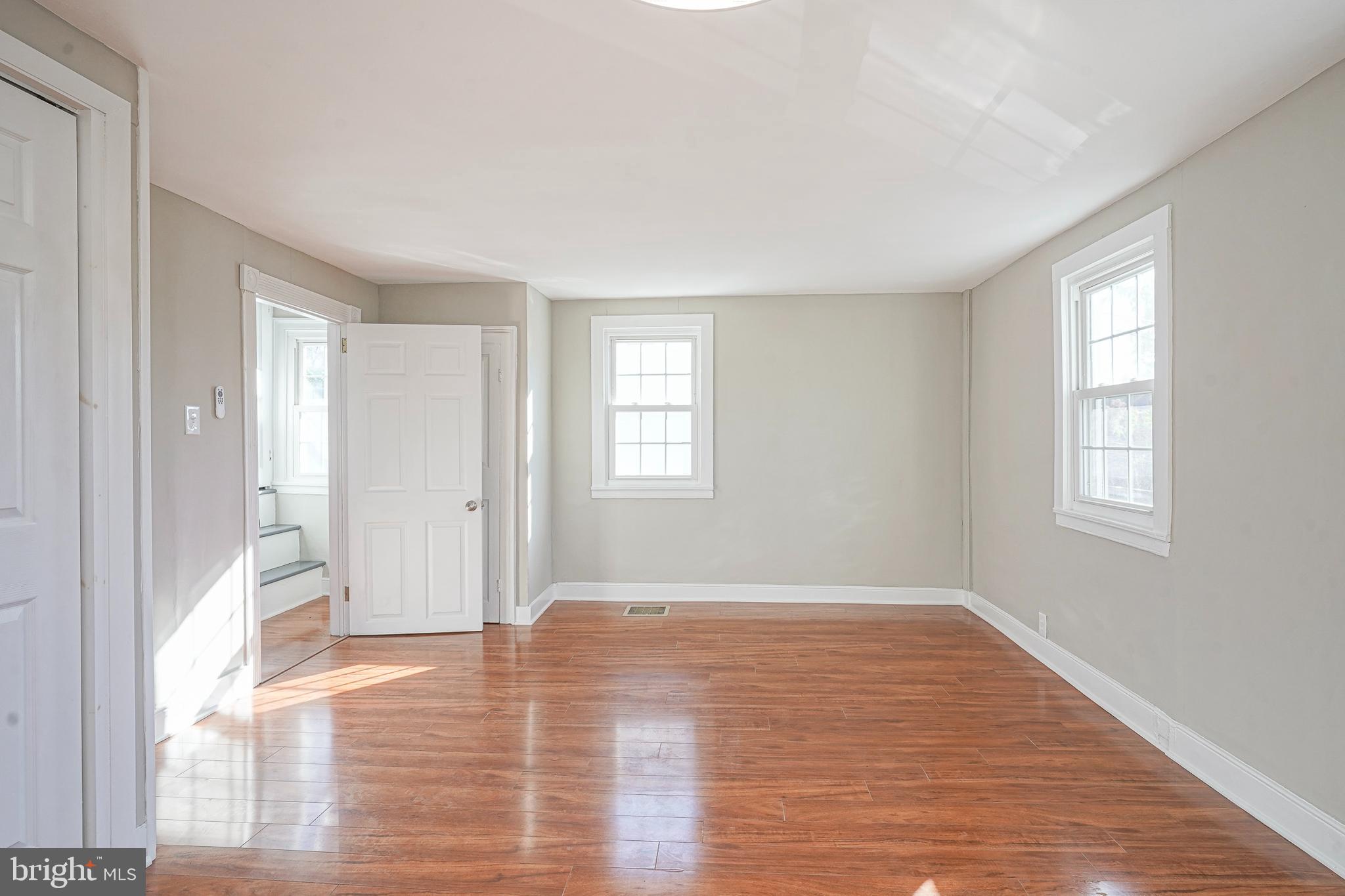 53 Branch Street Medford, NJ 08055 - Photo 35 of 41 a view of an empty room with wooden floor and a window