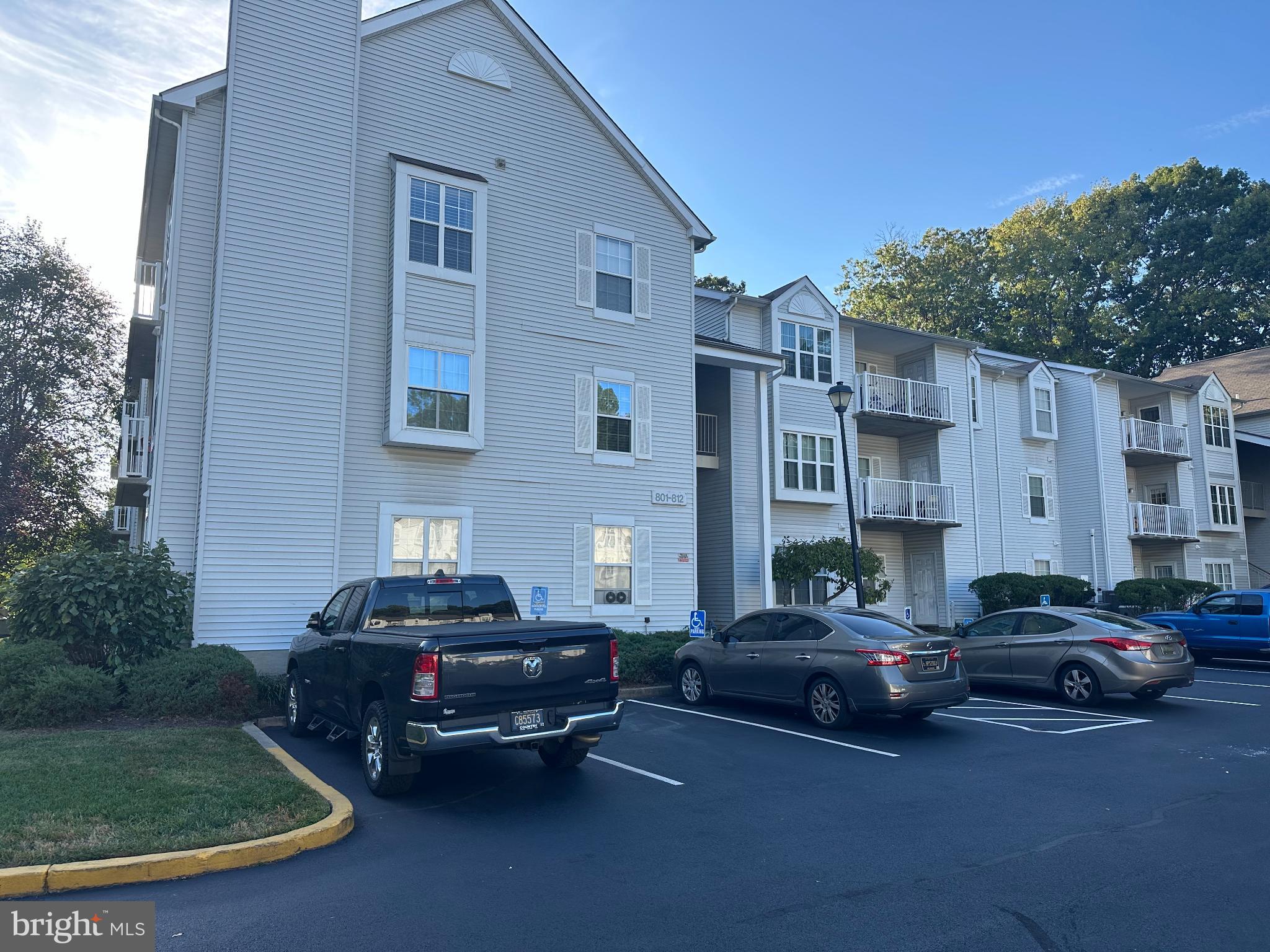 a car parked in front of a brick house