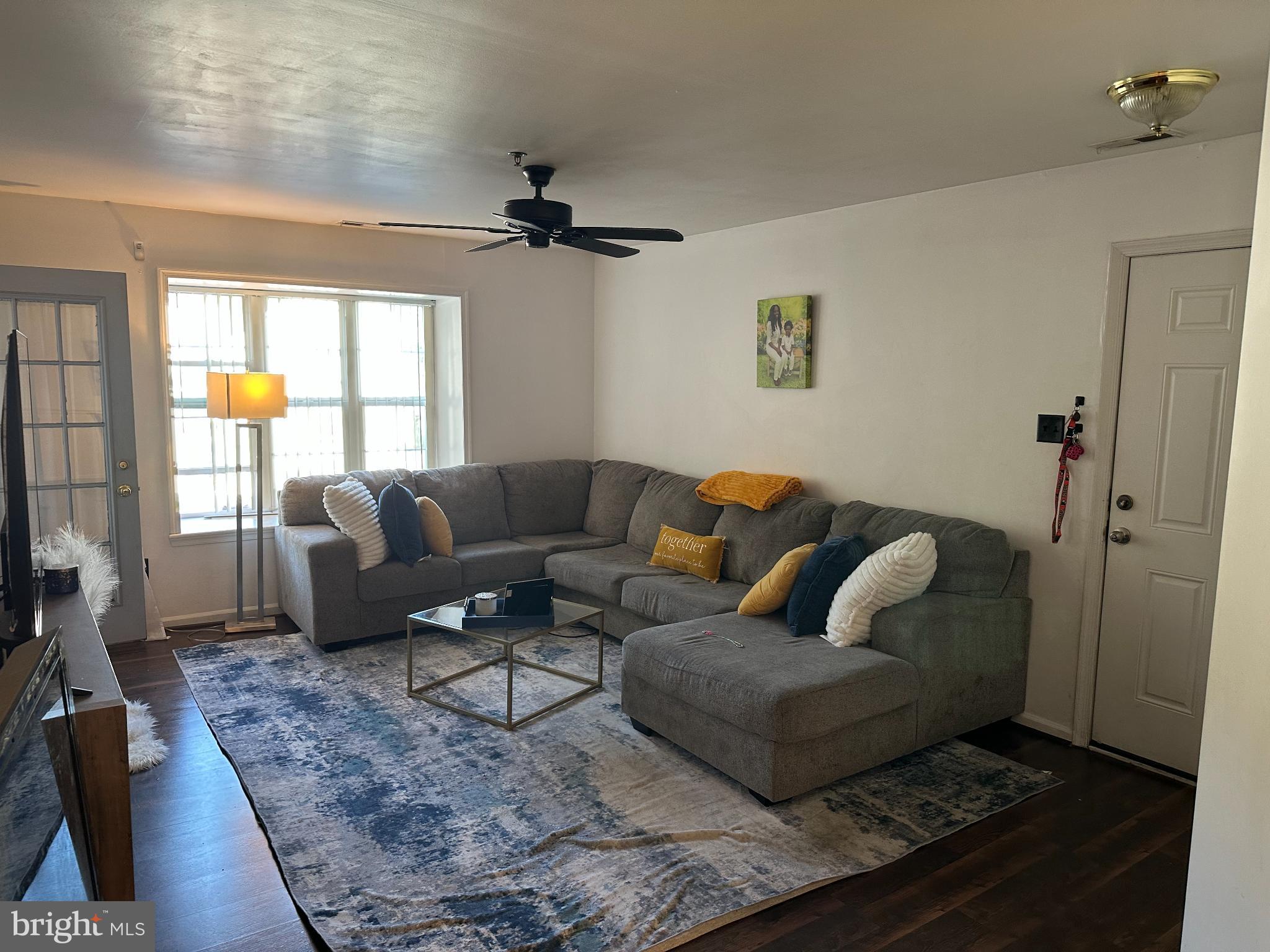 810 Willings Way New Castle, DE 19720 - Photo 2 of 11 a living room with furniture and a flat screen tv