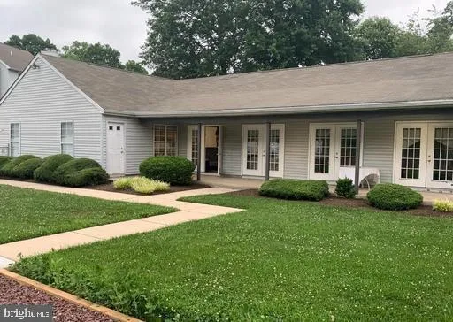 a view of a house with garden and yard