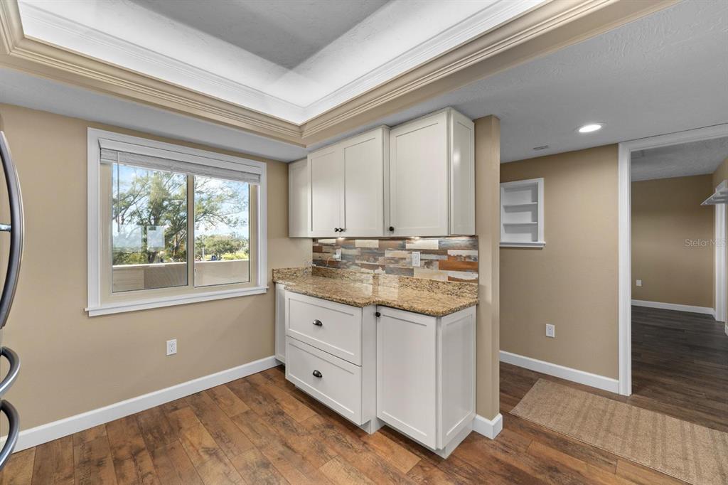 9604 Cortez Road West, Unit 136 Bradenton, FL 34210 - Photo 13 of 39 an empty room with window and wooden floor
