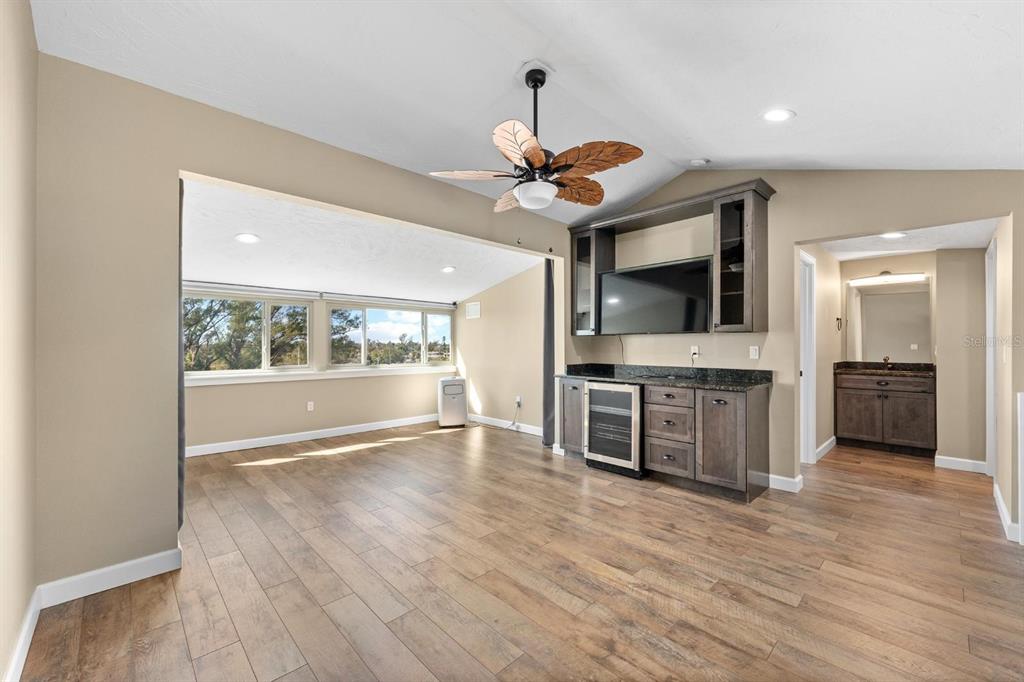 9604 Cortez Road West, Unit 136 Bradenton, FL 34210 - Photo 20 of 39 a view of an empty room with a window and a kitchen