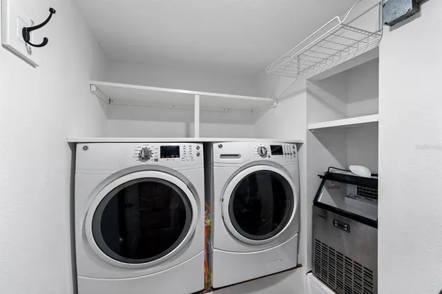 a utility room with dryer and washer