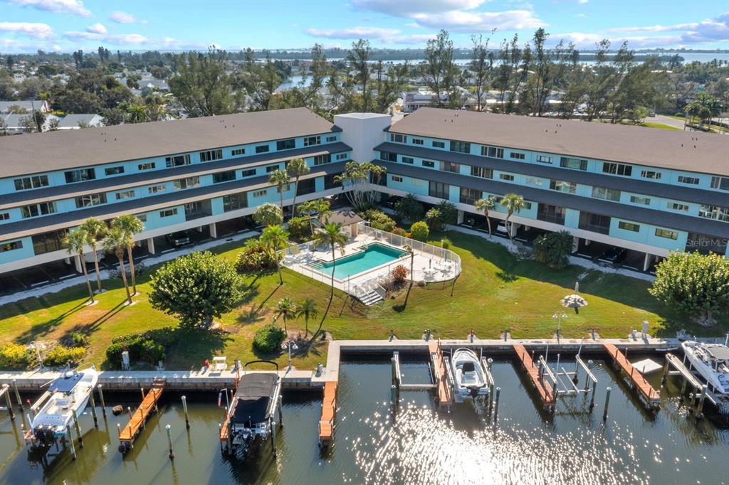 9604 Cortez Road West, Unit 136 Bradenton, FL 34210 - Photo 3 of 39 aerial view of a house with a swimming pool and lake view