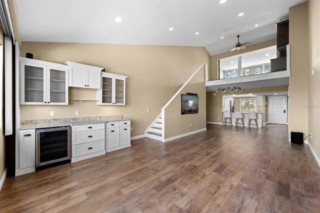 a view of a kitchen with a sink cabinets and wooden floor
