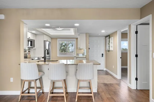 a kitchen with a table and chairs in it