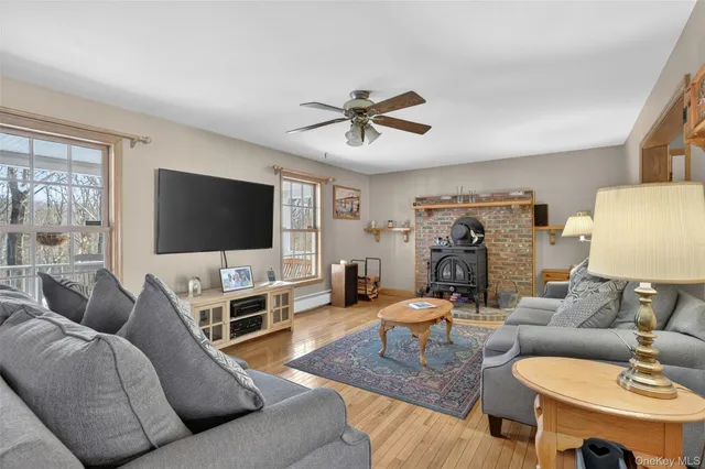 a kitchen with stainless steel appliances granite countertop a refrigerator a sink a stove and island