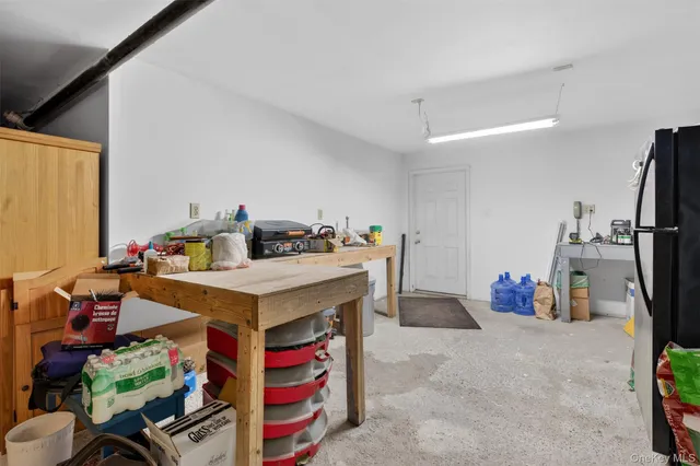 a utility room with cabinets and washer