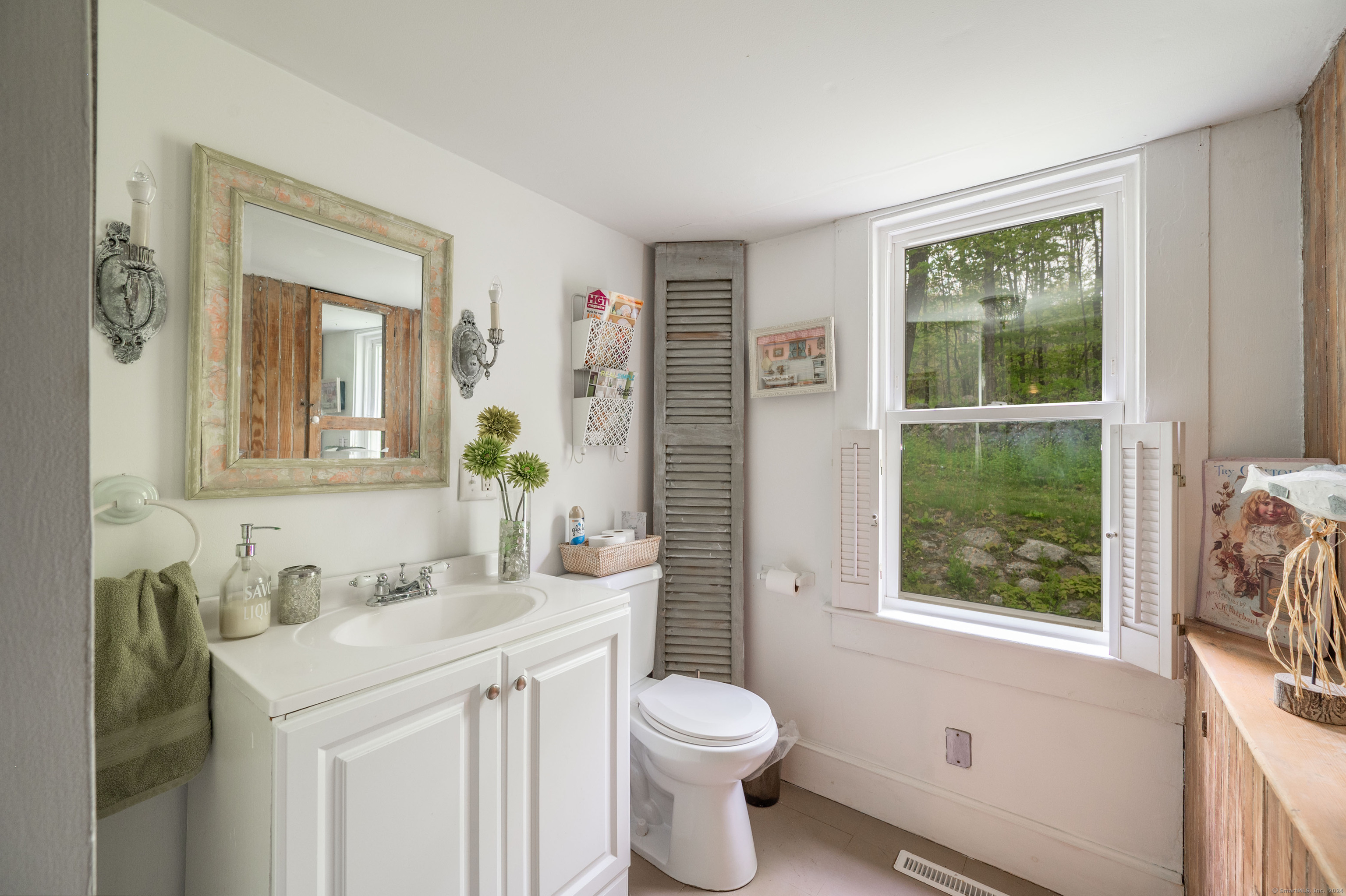 469 Platt Hill Road Winchester, CT 06098 - Photo 26 of 40 a bathroom with a sink vanity mirror and toilet
