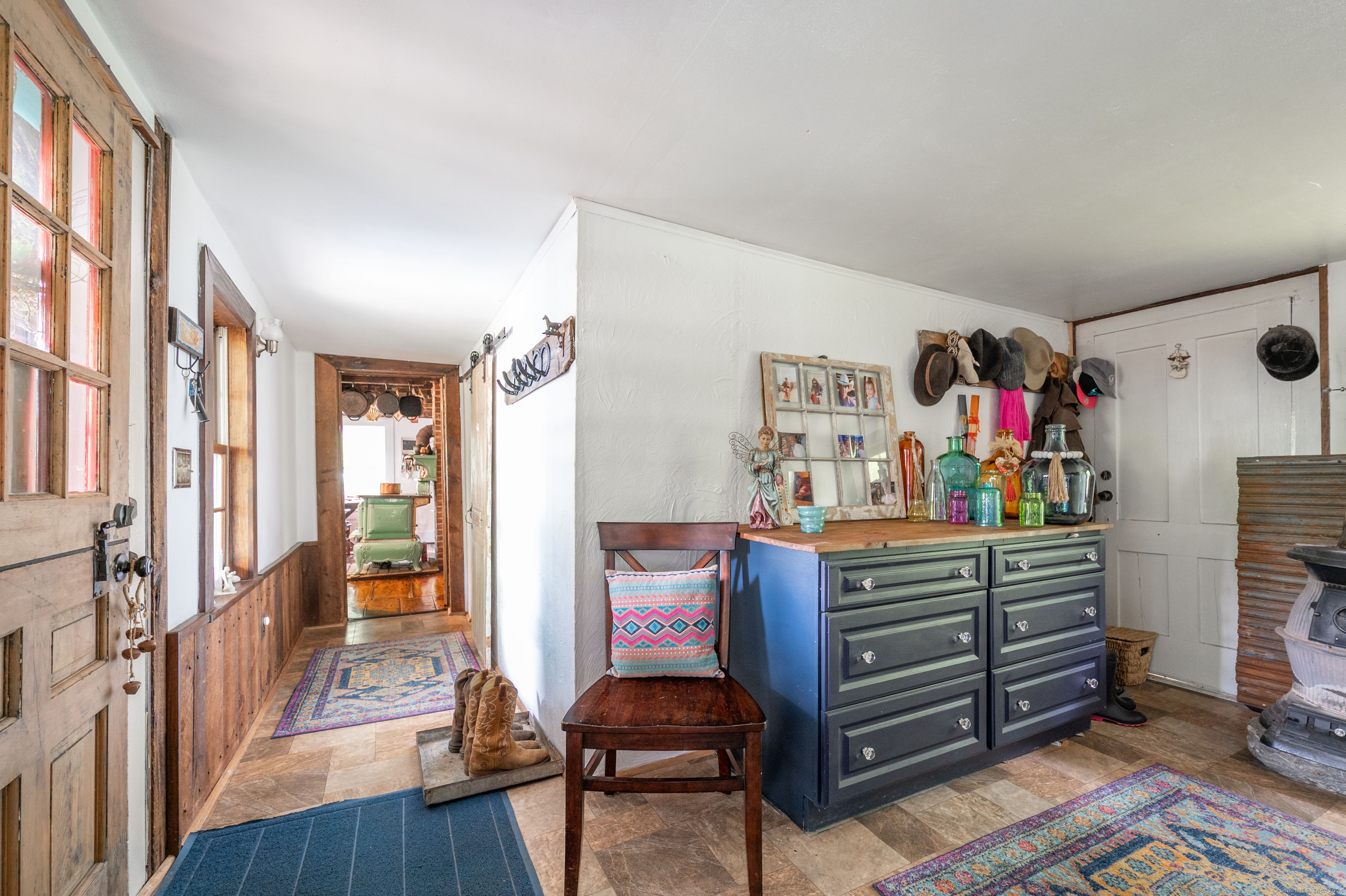 469 Platt Hill Road Winchester, CT 06098 - Photo 28 of 40 a room with furniture a rug and a window