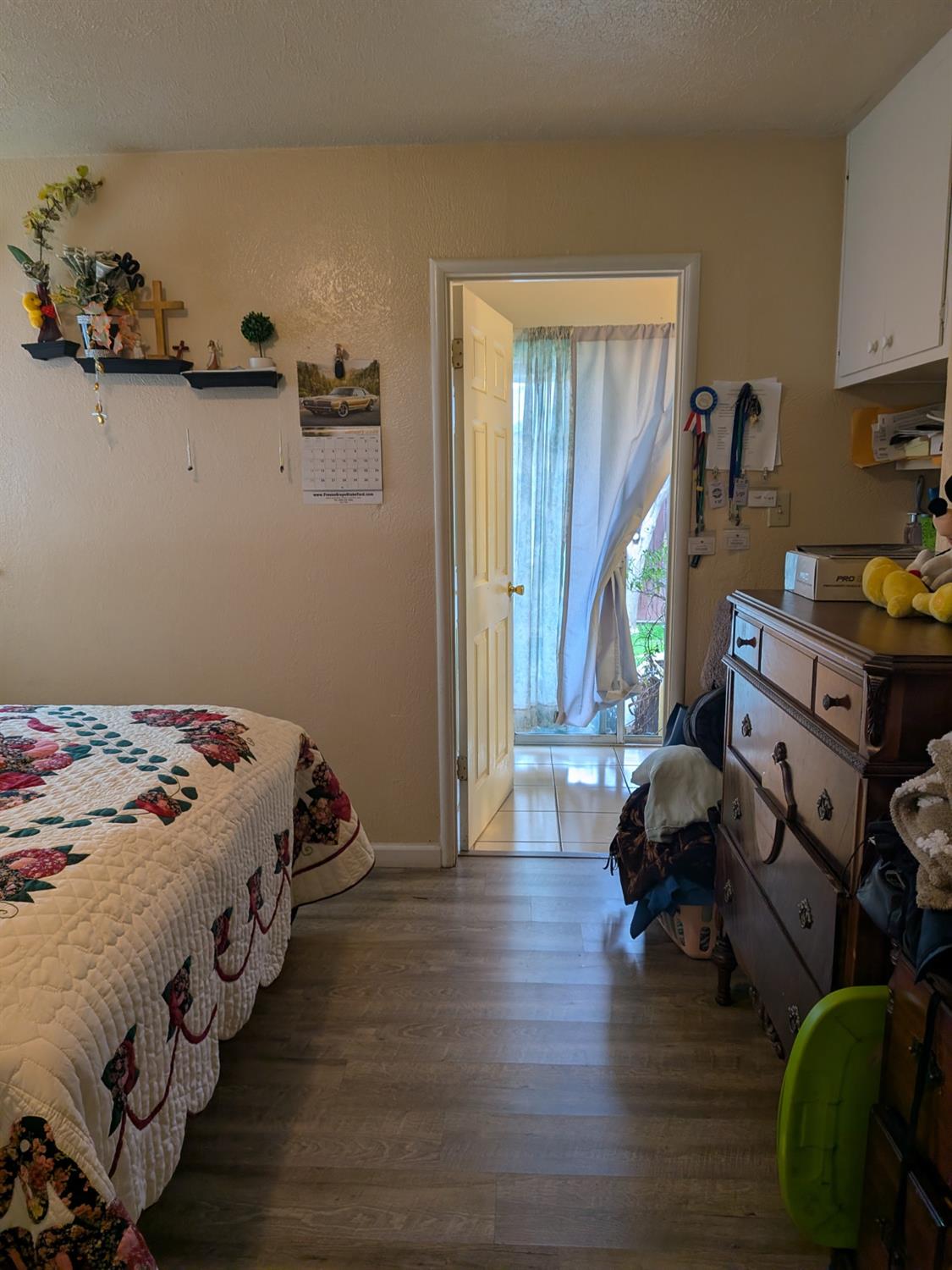 5209 North Angus Street Fresno, CA 93710 - Photo 15 of 33 a bedroom with bed and wooden floor