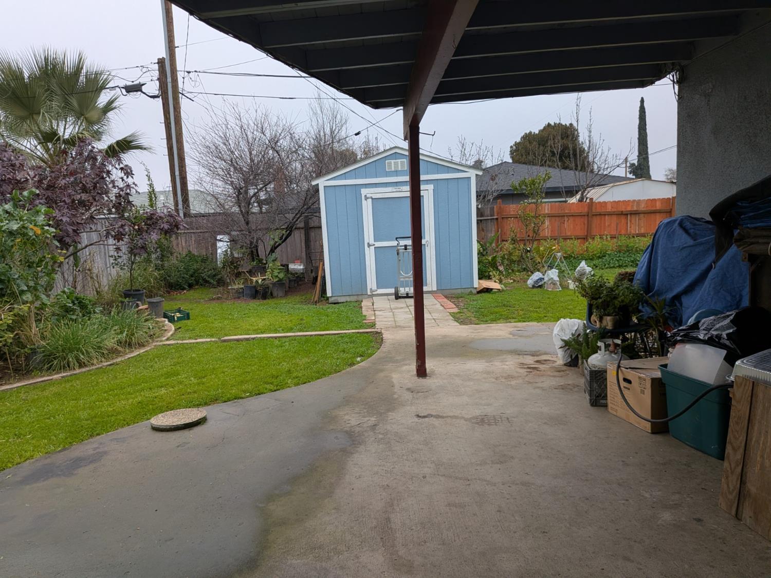 5209 North Angus Street Fresno, CA 93710 - Photo 27 of 33 a view of a house with backyard and porch