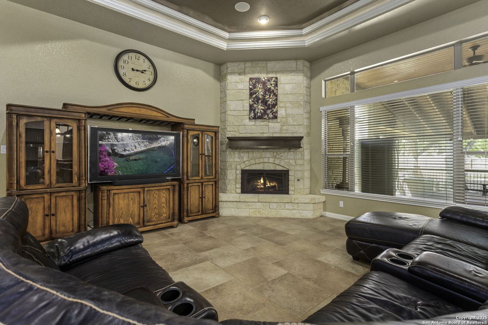 133 Copper Ridge Drive La Vernia, TX 78121 - Photo 12 of 35 a living room with furniture a window and a fireplace
