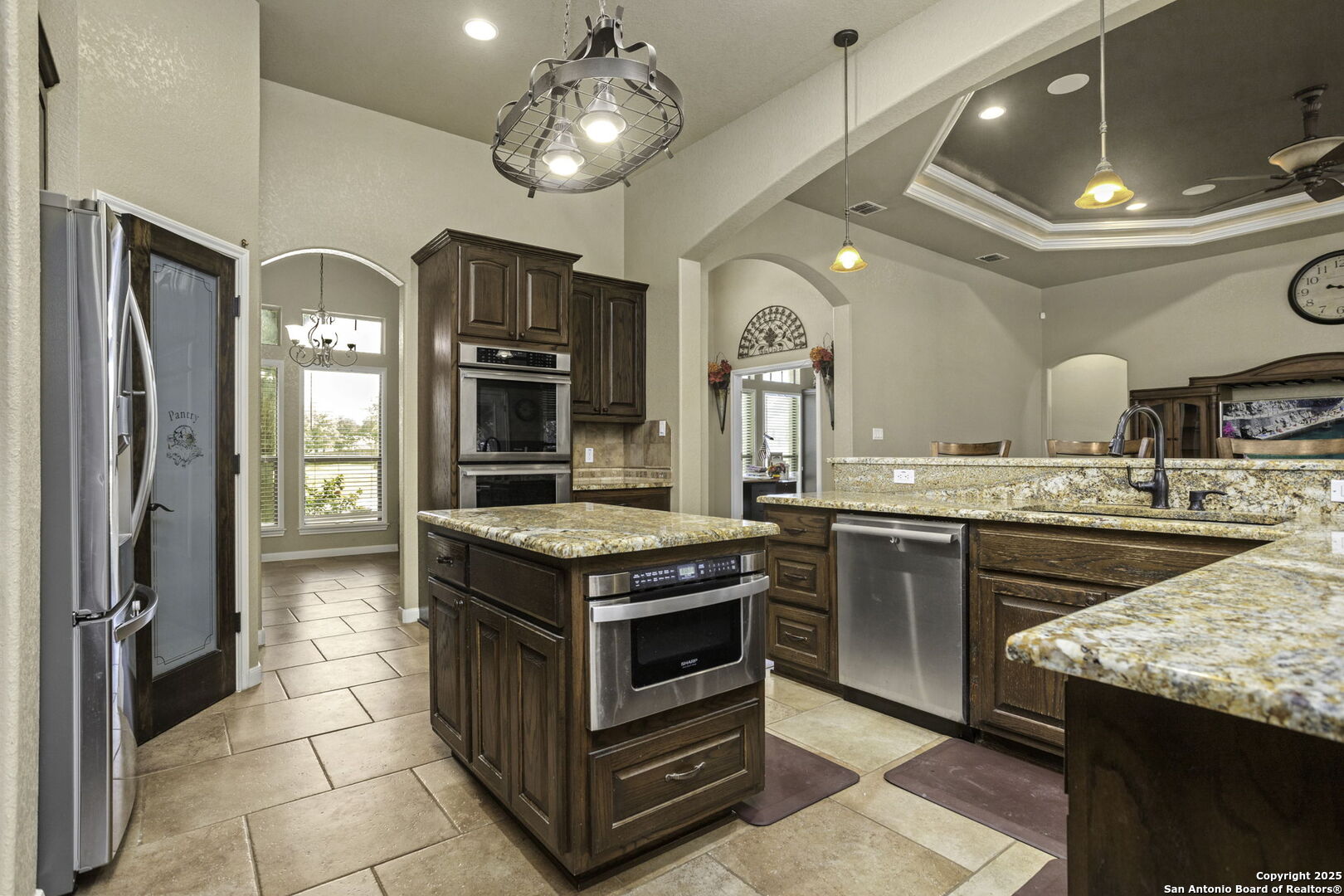 133 Copper Ridge Drive La Vernia, TX 78121 - Photo 13 of 35 a kitchen with a stove and a refrigerator