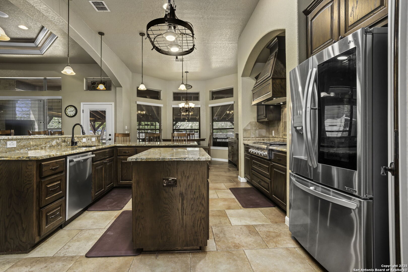 133 Copper Ridge Drive La Vernia, TX 78121 - Photo 15 of 35 a kitchen with stainless steel appliances granite countertop a stove and a sink