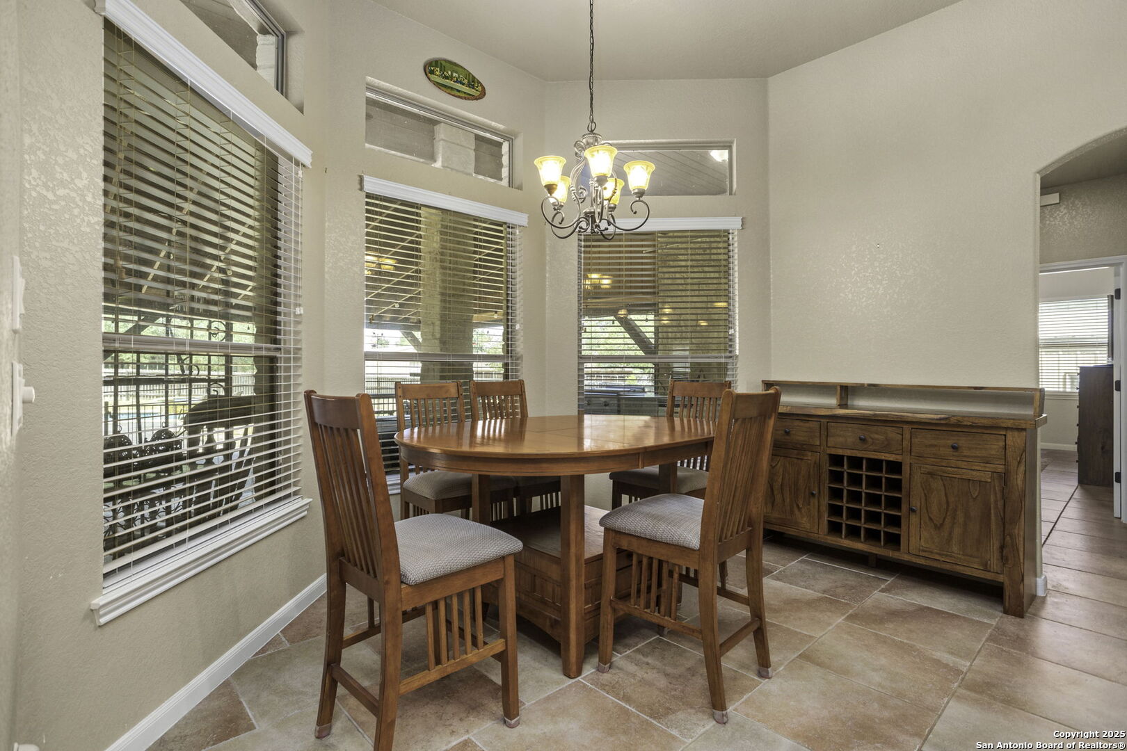 133 Copper Ridge Drive La Vernia, TX 78121 - Photo 18 of 35 a view of a dining room with furniture wooden floor and chandelier