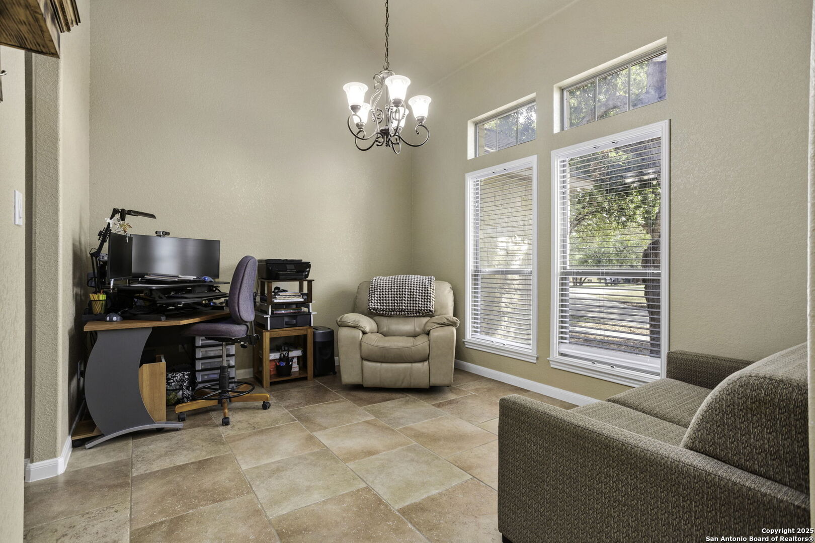 133 Copper Ridge Drive La Vernia, TX 78121 - Photo 19 of 35 a living room with furniture and a flat screen tv