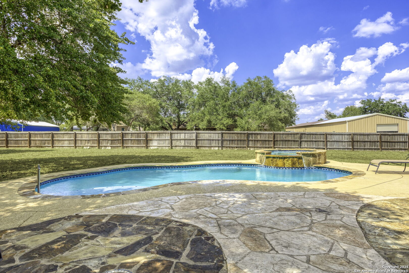 133 Copper Ridge Drive La Vernia, TX 78121 - Photo 2 of 35 a view of a swimming pool with an outdoor seating and yard