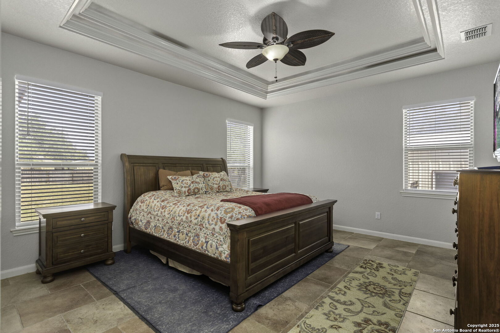 133 Copper Ridge Drive La Vernia, TX 78121 - Photo 21 of 35 a bedroom with a bed chandelier and a window