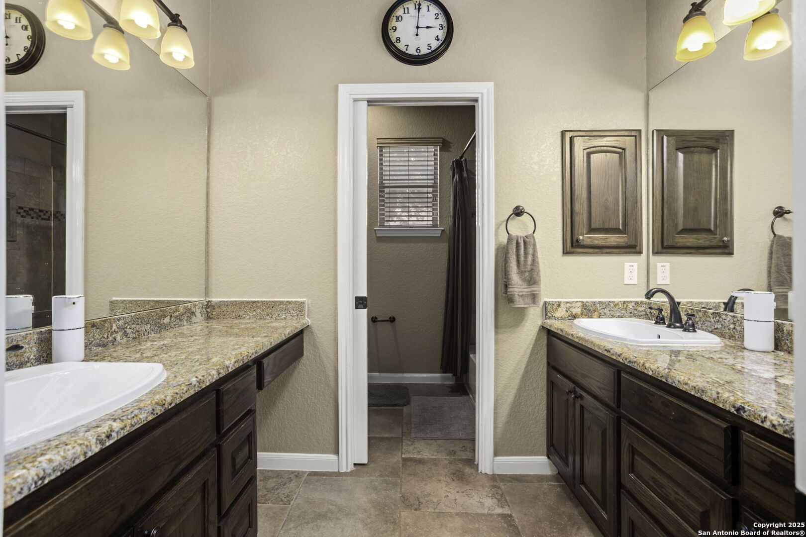 133 Copper Ridge Drive La Vernia, TX 78121 - Photo 27 of 35 a bathroom with a granite countertop sink and a mirror