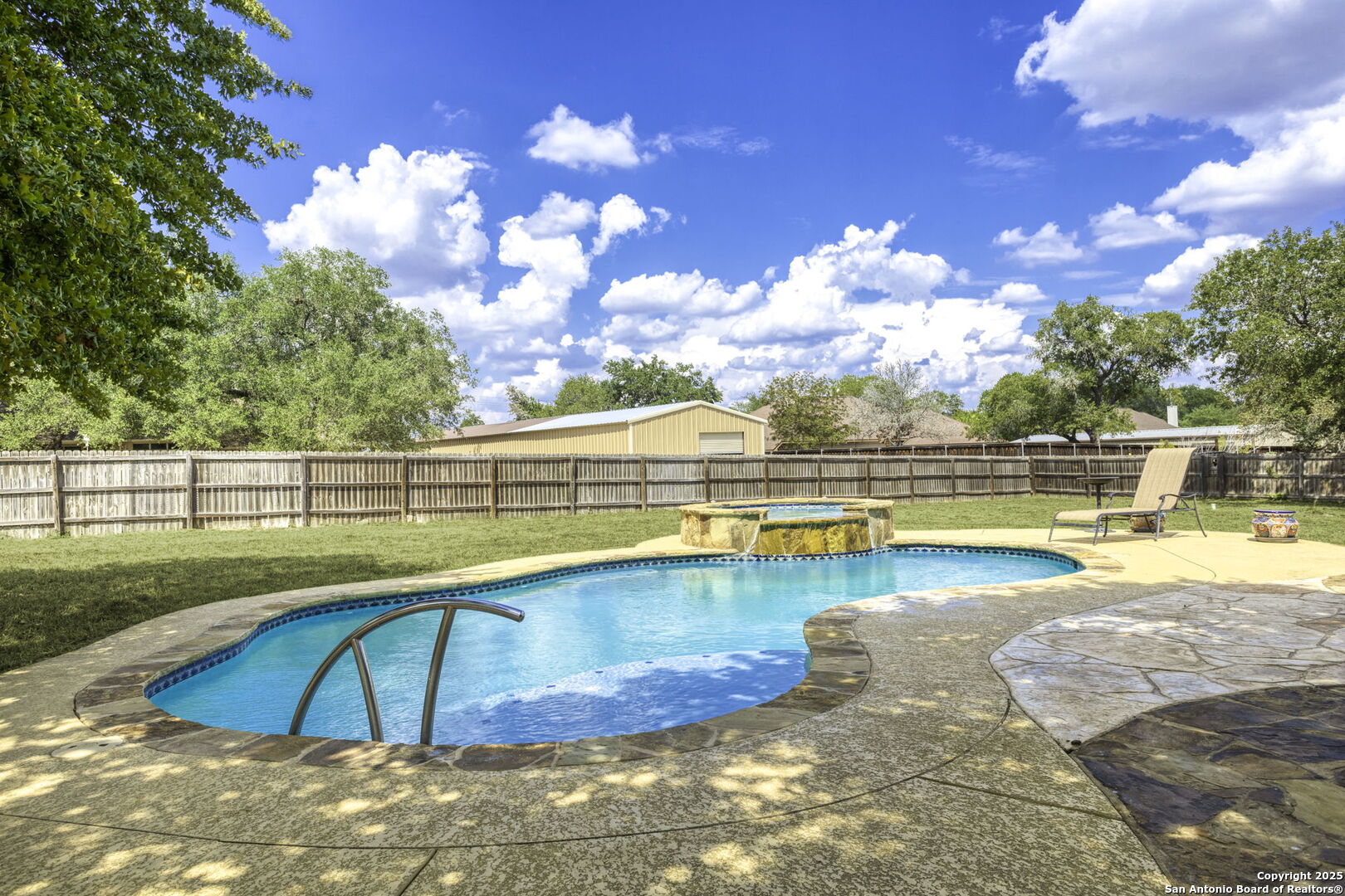 133 Copper Ridge Drive La Vernia, TX 78121 - Photo 30 of 35 a view of a swimming pool with an outdoor seating and yard