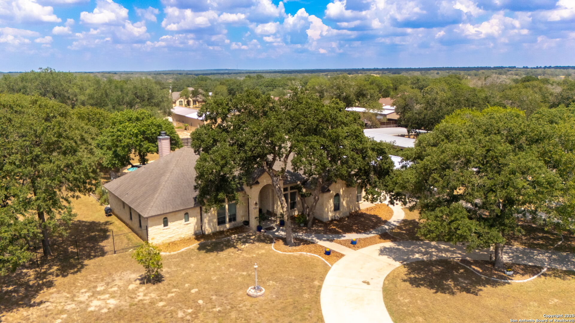 133 Copper Ridge Drive La Vernia, TX 78121 - Photo 4 of 35 a view of a yard with table and chairs