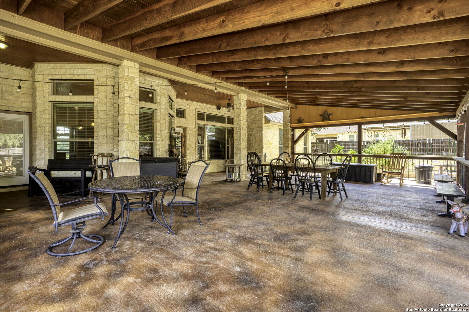 133 Copper Ridge Drive La Vernia, TX 78121 - Photo 5 of 35 a view of a chairs and tables in a patio