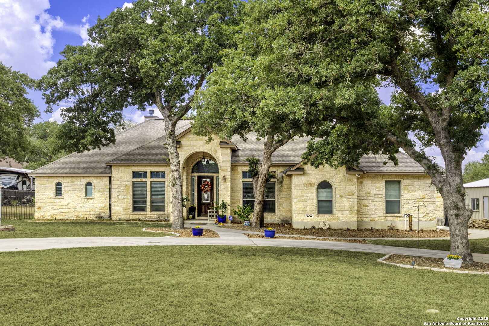 133 Copper Ridge Drive La Vernia, TX 78121 - Photo 9 of 35 a front view of a house with swimming pool and porch