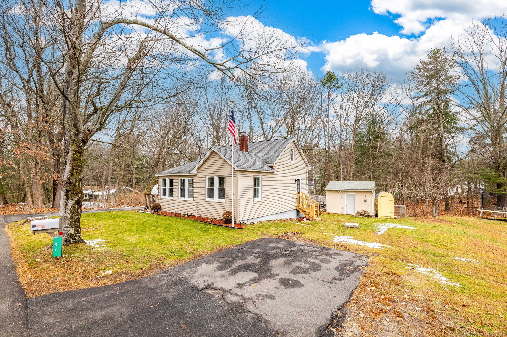 37 Carpenter Road Bolton, CT 06043 - Photo 3 of 17 a view of a house with swimming pool and trees in the background