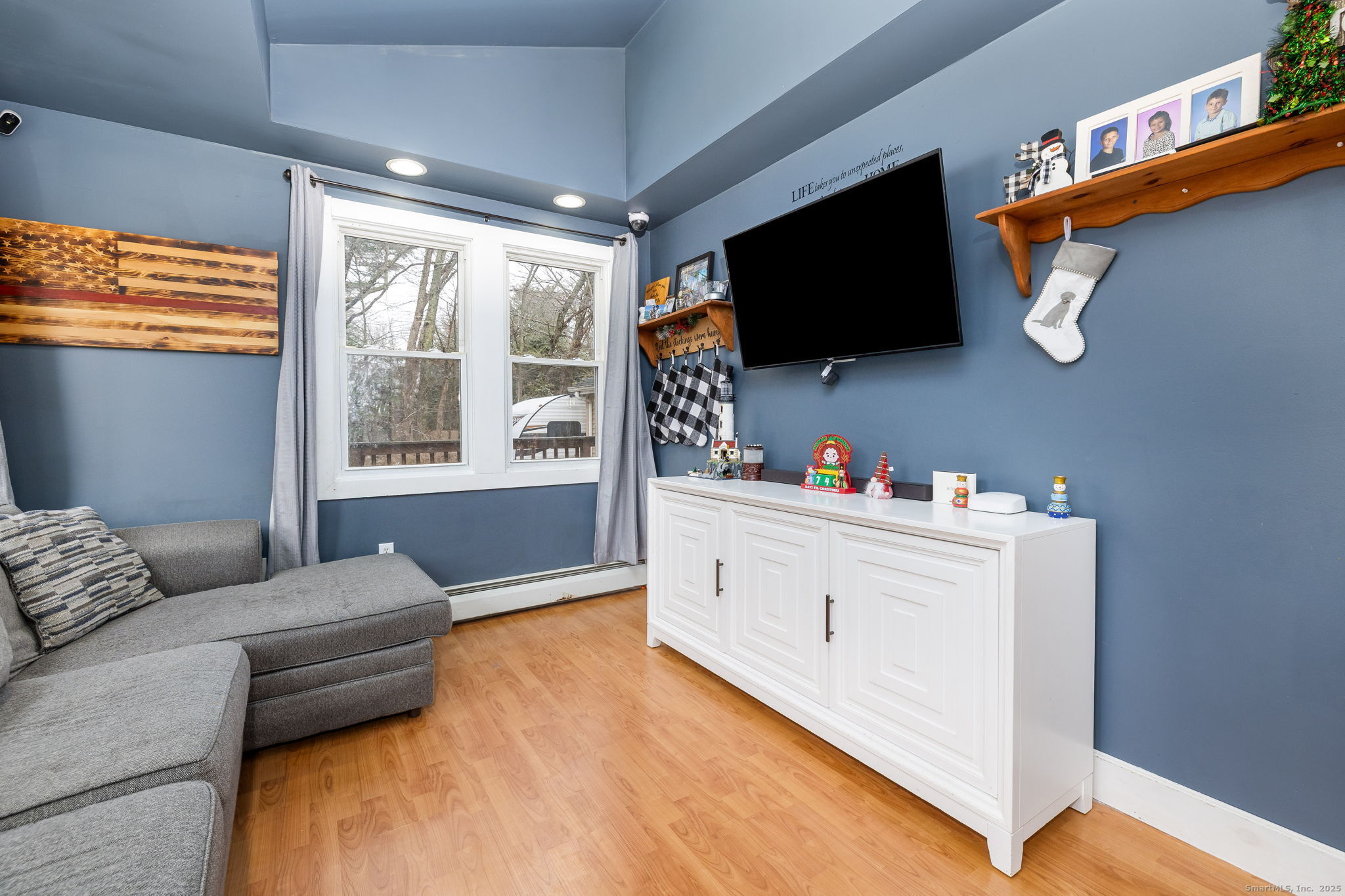 37 Carpenter Road Bolton, CT 06043 - Photo 9 of 17 a living room with furniture and a flat screen tv