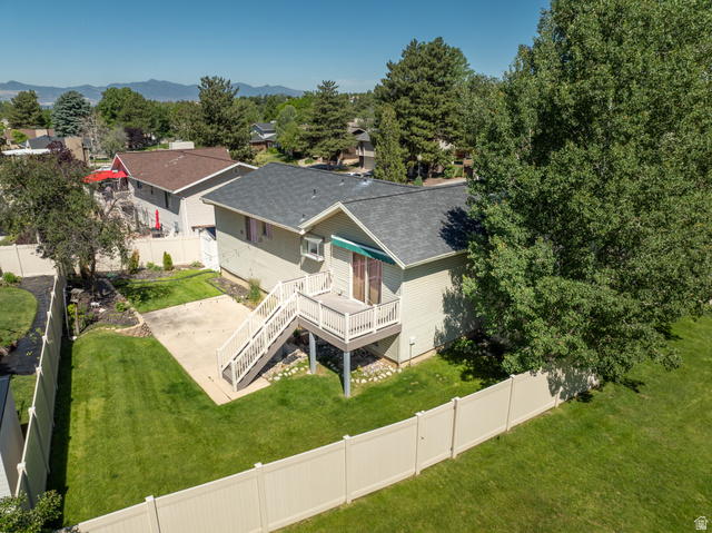 2088 Falcon Way Sandy, UT 84093 - Photo 33 of 46 Spacious backyard featuring a multi-level deck, concrete patio, expansive lawn, and full privacy fencing