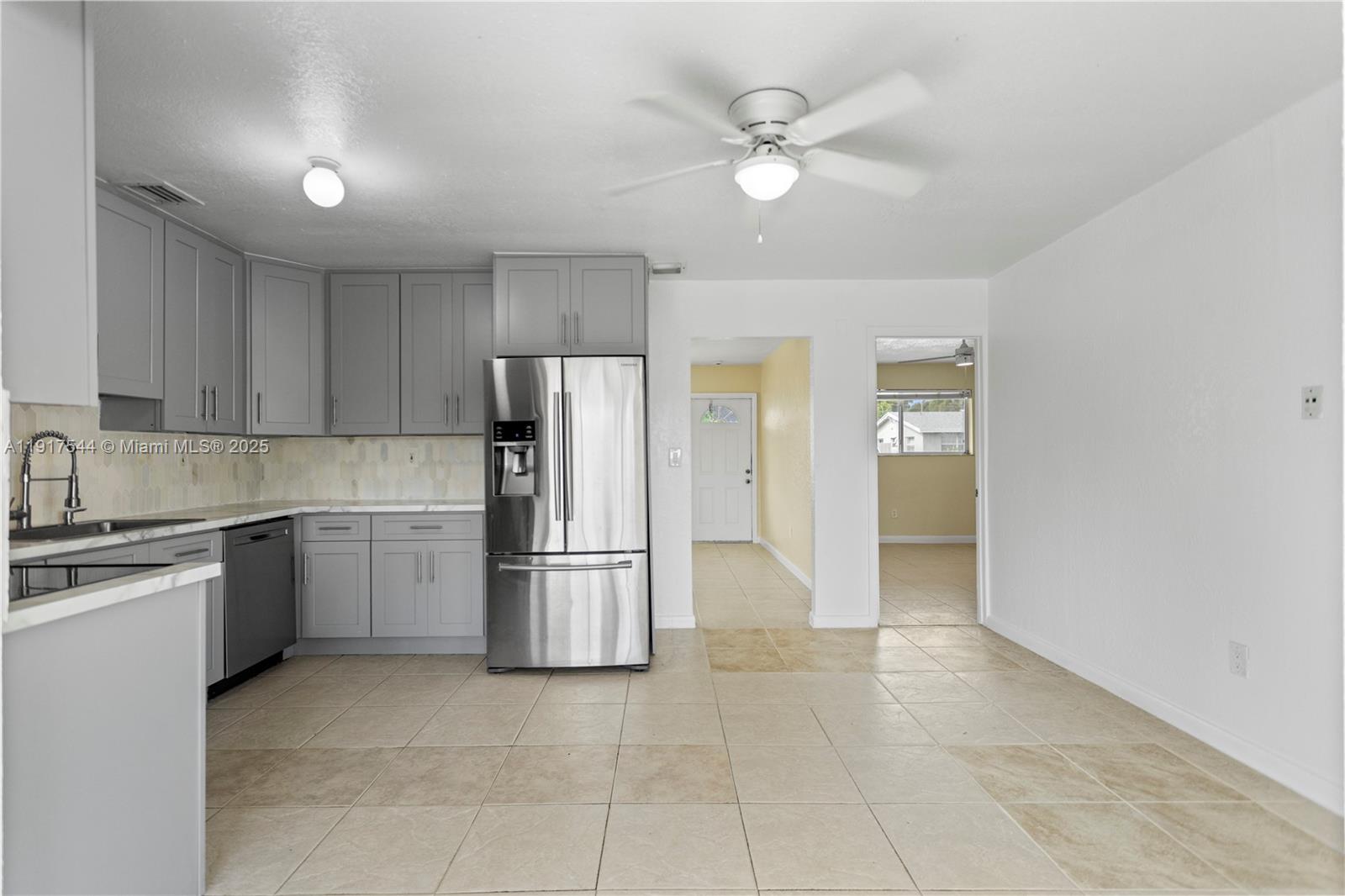 1831 Southwest 97th Terrace Miramar, FL 33025 - Photo 24 of 61 a kitchen with a refrigerator a oven and a sink