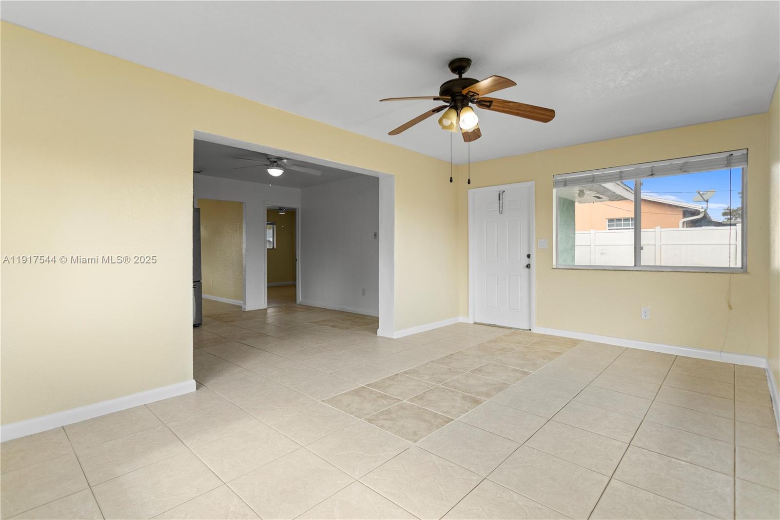 1831 Southwest 97th Terrace Miramar, FL 33025 - Photo 27 of 61 a view of a livingroom with a ceiling fan and window