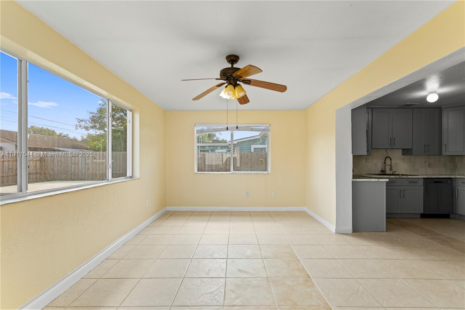 1831 Southwest 97th Terrace Miramar, FL 33025 - Photo 29 of 61 a view of an empty room with a window and kitchen view