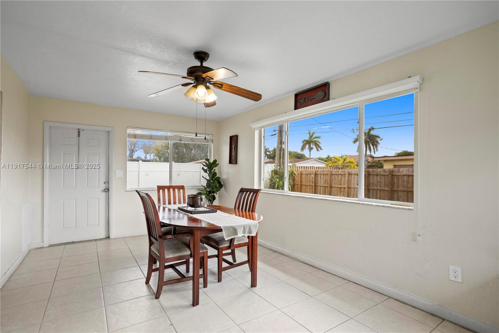 1831 Southwest 97th Terrace Miramar, FL 33025 - Photo 32 of 61 a dining room with furniture and window