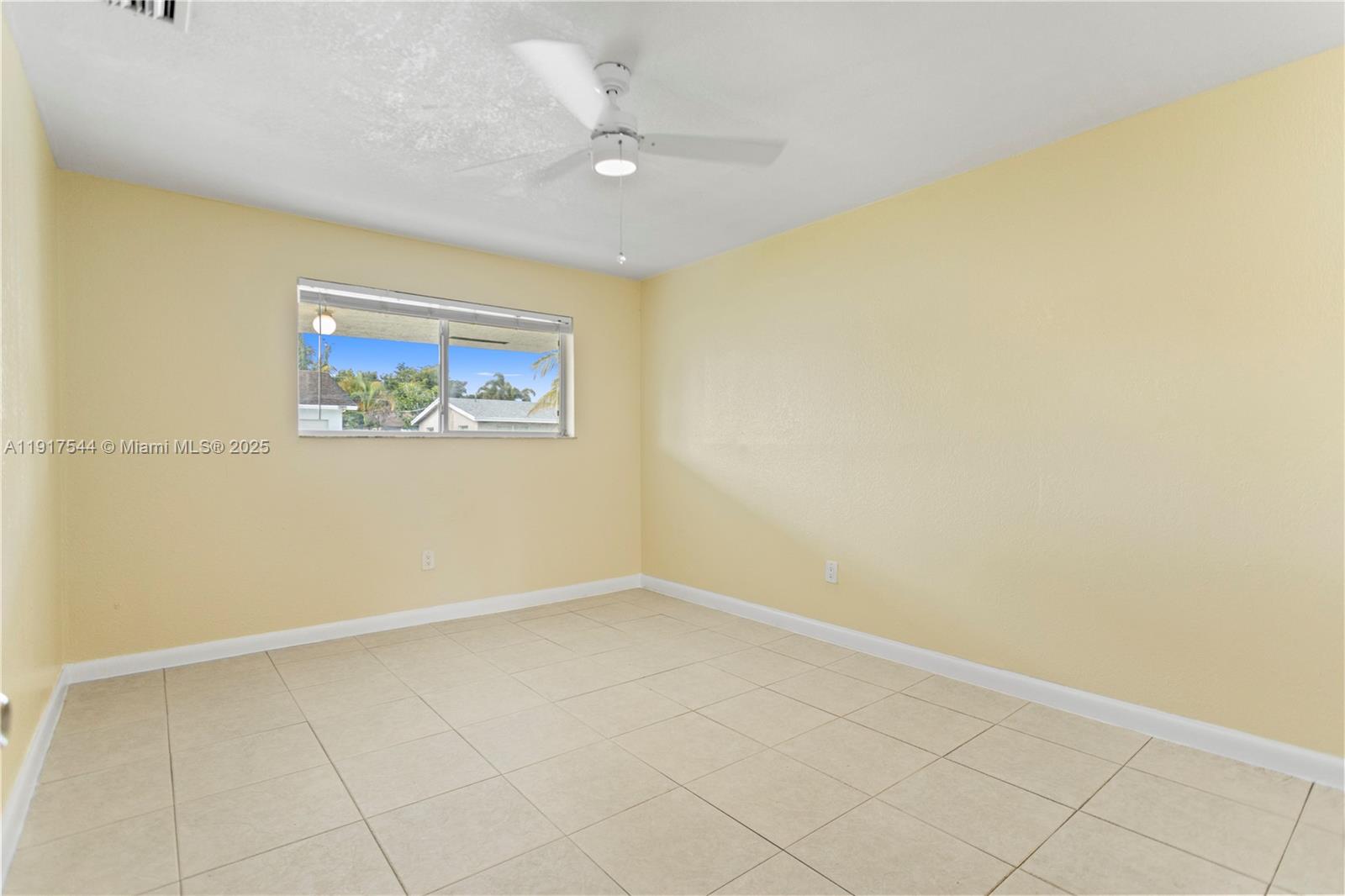 1831 Southwest 97th Terrace Miramar, FL 33025 - Photo 35 of 61 an empty room with a painting on the wall