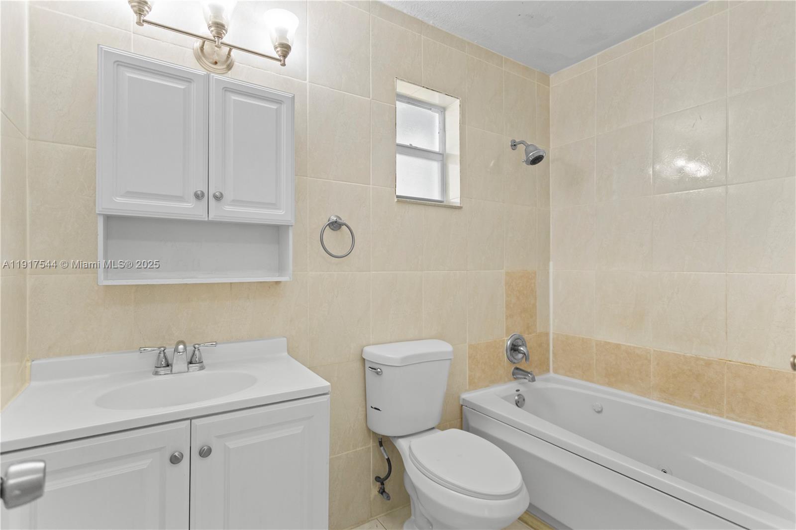 1831 Southwest 97th Terrace Miramar, FL 33025 - Photo 40 of 61 a bathroom with a sink a toilet and shower