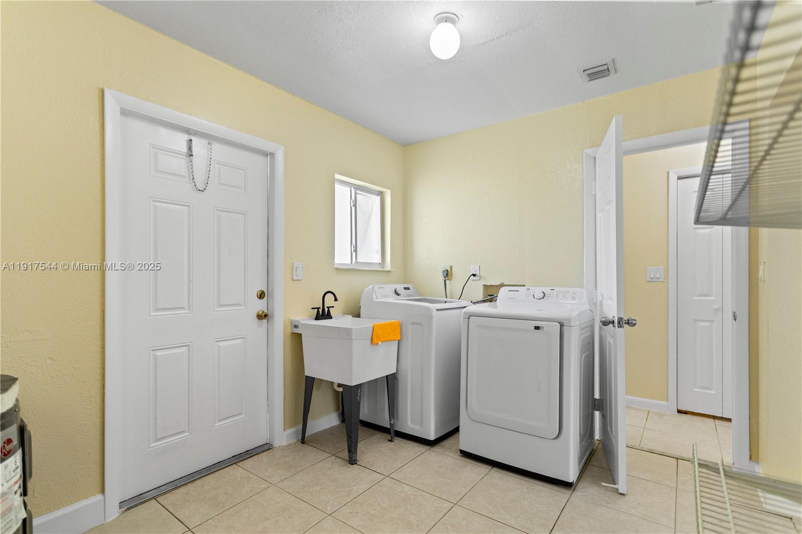 1831 Southwest 97th Terrace Miramar, FL 33025 - Photo 45 of 61 a utility room with dryer and washer
