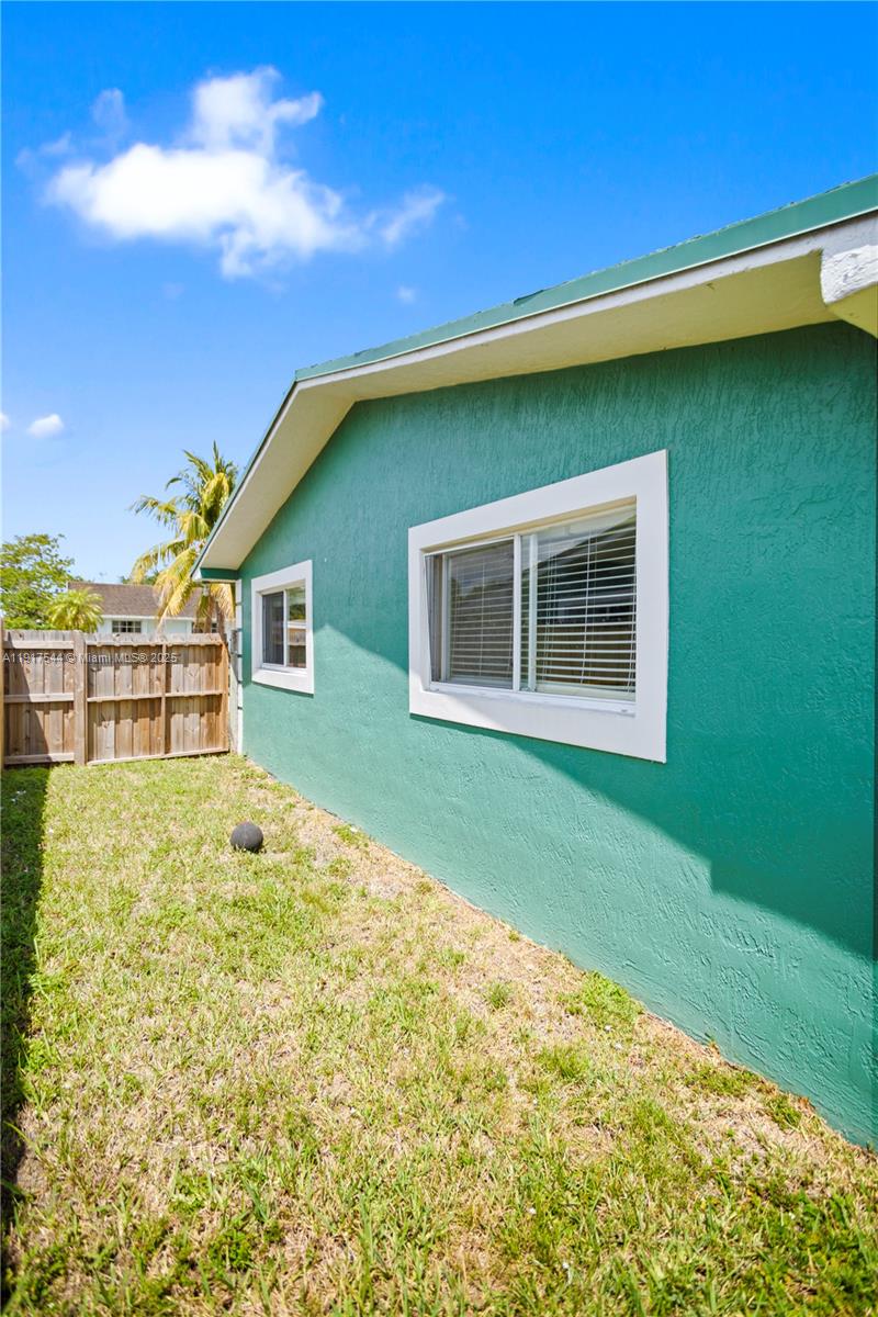 1831 Southwest 97th Terrace Miramar, FL 33025 - Photo 55 of 61 a house view with a garden space