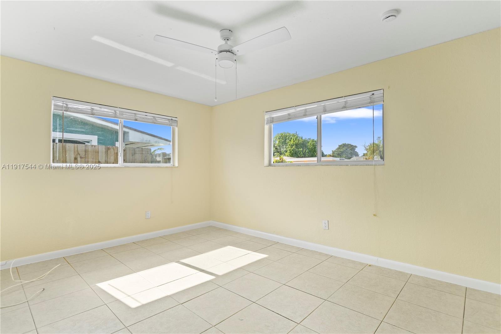 1831 Southwest 97th Terrace Miramar, FL 33025 - Photo 8 of 61 a view of room with window and ceiling fan