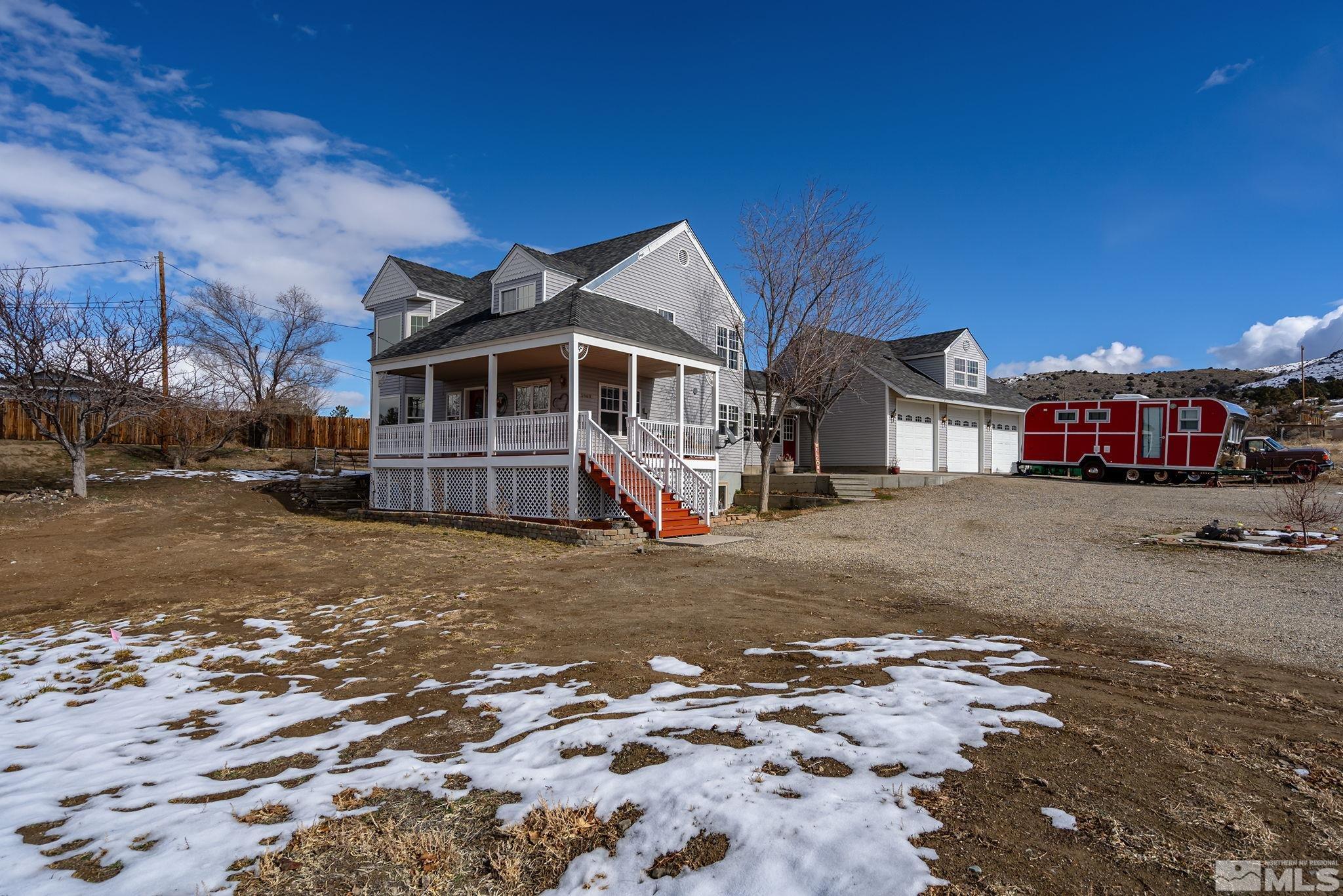 5960 Mallow Road Carson City, NV 89701 - Photo 1 of 34 a view of a house with a yard